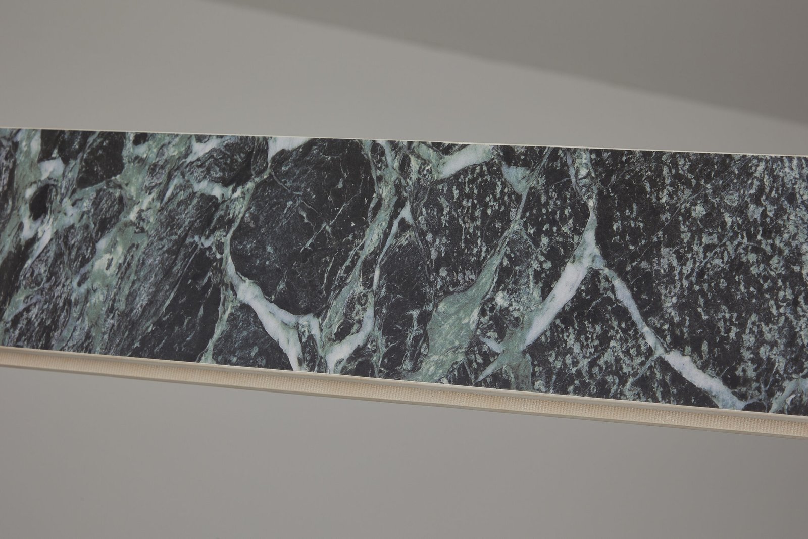 High-resolution marble-effect linear lighting texture close-up