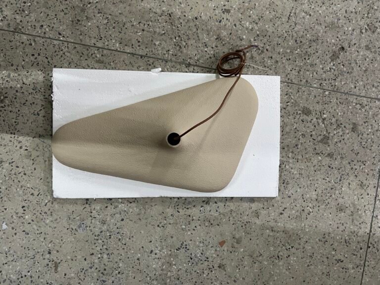 Wabi-sabi pendant shade and cable viewed from above during sample inspection