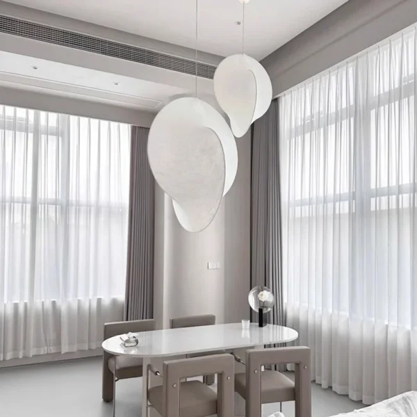 OBS031 sculptural silk pendants above a round dining table